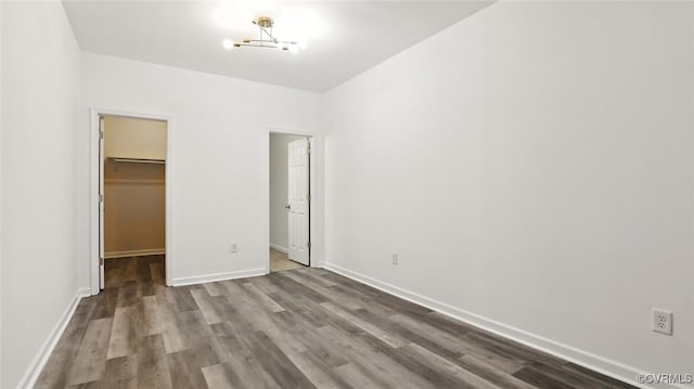 566 Abbey Village Cir, Midlothian, VA 23114 - unfurnished bedroom with wood finished floors and a spacious closet