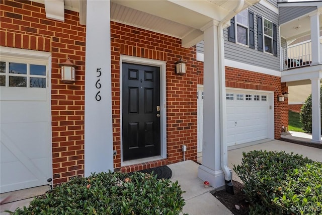 566 Abbey Village Cir, Midlothian, VA 23114 - view of exterior entry with brick siding, a garage, and a porch