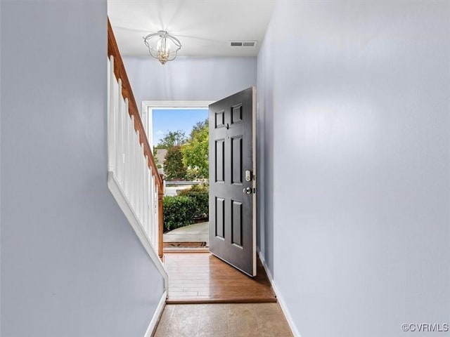 566 Abbey Village Cir, Midlothian, VA 23114 - doorway with a chandelier and stairs