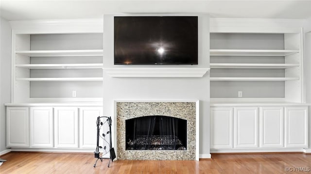 566 Abbey Village Cir, Midlothian, VA 23114 - unfurnished living room featuring a fireplace, light wood-style floors, and built in features
