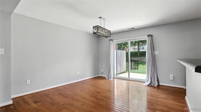 566 Abbey Village Cir, Midlothian, VA 23114 - unfurnished dining area featuring wood finished floors and a chandelier
