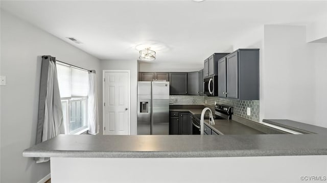 566 Abbey Village Cir, Midlothian, VA 23114 - kitchen with stainless steel appliances, tasteful backsplash, and a peninsula