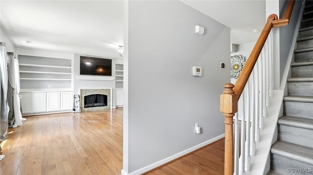 566 Abbey Village Cir, Midlothian, VA 23114 - staircase with wood finished floors, a fireplace, and built in shelves