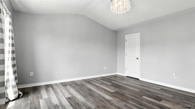 566 Abbey Village Cir, Midlothian, VA 23114 - spare room with vaulted ceiling, dark wood finished floors, and a chandelier
