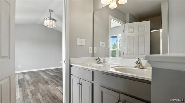 566 Abbey Village Cir, Midlothian, VA 23114 - full bathroom with lofted ceiling, double vanity, a shower with shower door, and wood finished floors