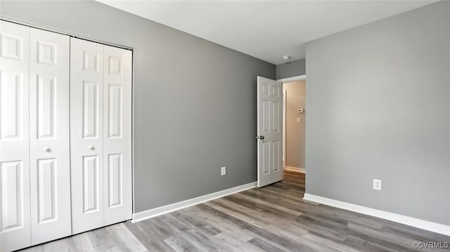 566 Abbey Village Cir, Midlothian, VA 23114 - unfurnished bedroom featuring a closet and wood finished floors