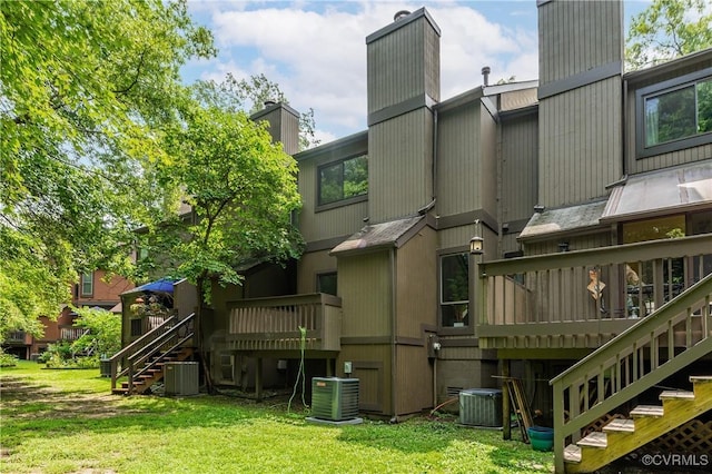 11904 W Briar Patch Dr, Midlothian, VA 23113 - back of property with stairs, a chimney, a wooden deck, and a yard