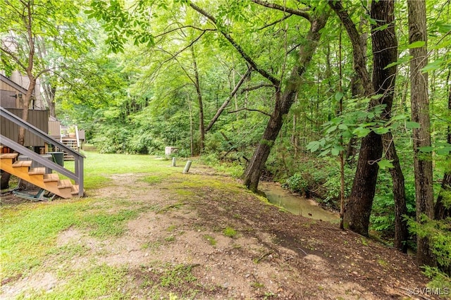 11904 W Briar Patch Dr, Midlothian, VA 23113 - view of green lawn with stairway and a forest view