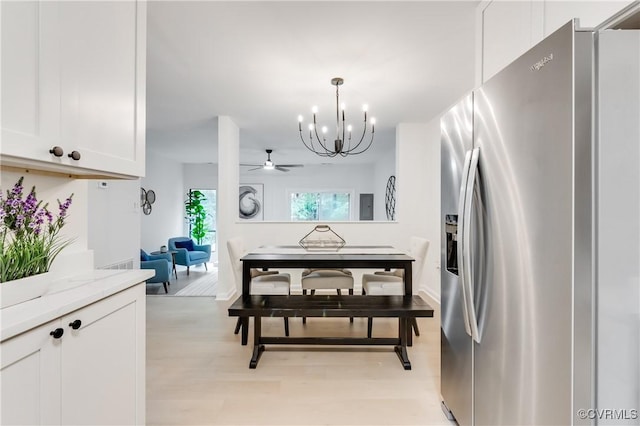 11904 W Briar Patch Dr, Midlothian, VA 23113 - kitchen featuring stainless steel refrigerator with ice dispenser, a chandelier, white cabinetry, light wood-style flooring, and light stone counters