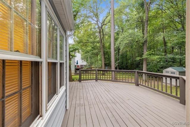 12628 Copperas Ln, Richmond, VA 23233 - wooden terrace with a storage unit and view of wooded area