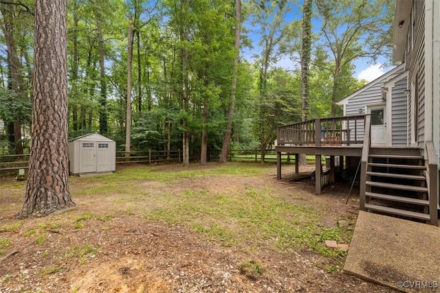 12628 Copperas Ln, Richmond, VA 23233 - fenced backyard with a deck, stairway, and a storage shed