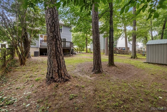 12628 Copperas Ln, Richmond, VA 23233 - view of yard with a wooden deck and an outdoor structure