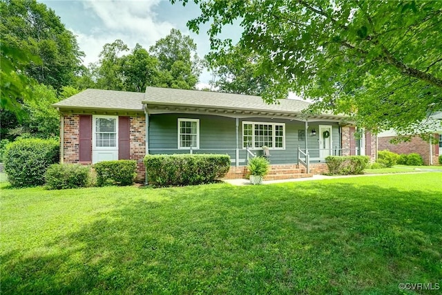 10070 Rinker Dr, Mechanicsville, VA 23116 - ranch-style house with a porch, a front lawn, brick siding, and a shingled roof
