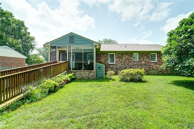 10070 Rinker Dr, Mechanicsville, VA 23116 - back of property with a sunroom, brick siding, and a lawn