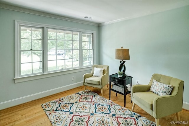 10070 Rinker Dr, Mechanicsville, VA 23116 - sitting room featuring healthy amount of natural light, ornamental molding, and wood finished floors