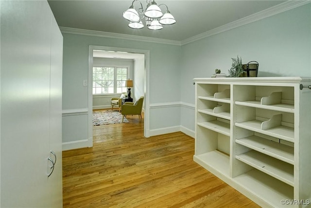 10070 Rinker Dr, Mechanicsville, VA 23116 - hall with wood finished floors, a chandelier, and crown molding