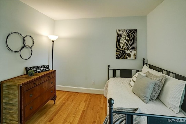 10070 Rinker Dr, Mechanicsville, VA 23116 - bedroom with light wood-style flooring and baseboards