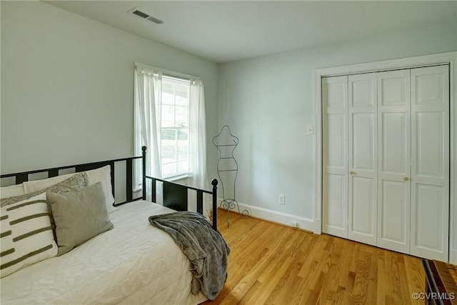 10070 Rinker Dr, Mechanicsville, VA 23116 - bedroom with light wood-style flooring and a closet