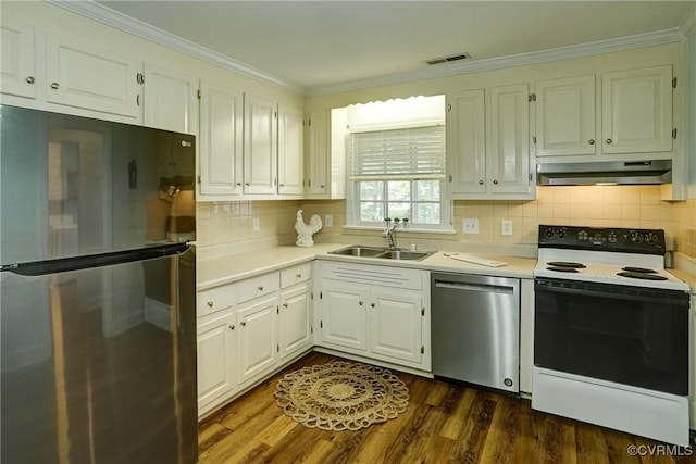 10070 Rinker Dr, Mechanicsville, VA 23116 - kitchen with appliances with stainless steel finishes, under cabinet range hood, light countertops, white cabinets, and crown molding