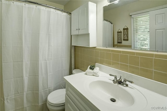 10070 Rinker Dr, Mechanicsville, VA 23116 - bathroom featuring tile walls, vanity, and a shower with curtain