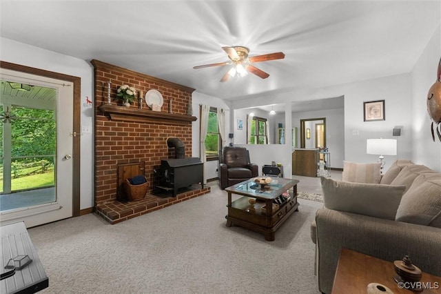 124 Gammons Vw, Bumpass, VA 23024 - living area with a wood stove, ceiling fan, and carpet floors