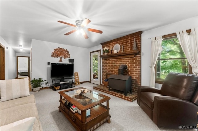 124 Gammons Vw, Bumpass, VA 23024 - carpeted living area featuring a wood stove and ceiling fan