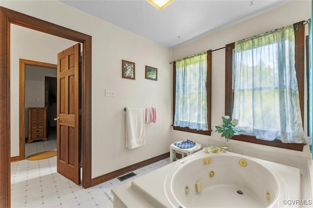 124 Gammons Vw, Bumpass, VA 23024 - bathroom with a tub with jets and tile patterned floors