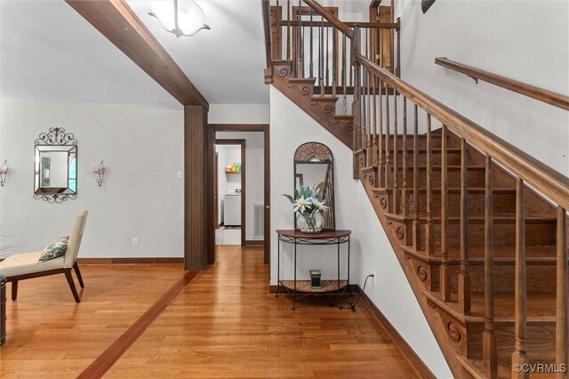 124 Gammons Vw, Bumpass, VA 23024 - stairs featuring washer / dryer and wood finished floors