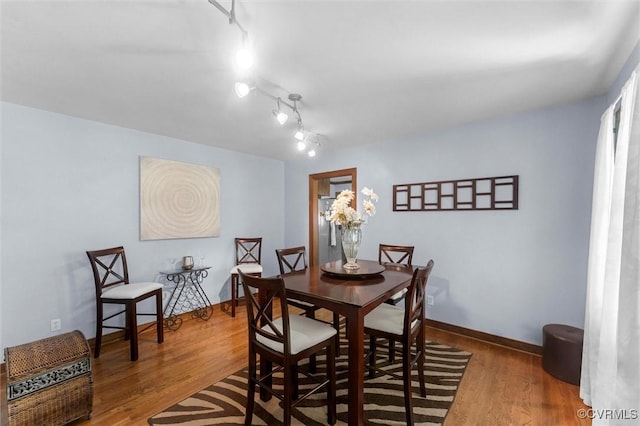 124 Gammons Vw, Bumpass, VA 23024 - dining space featuring wood finished floors and rail lighting