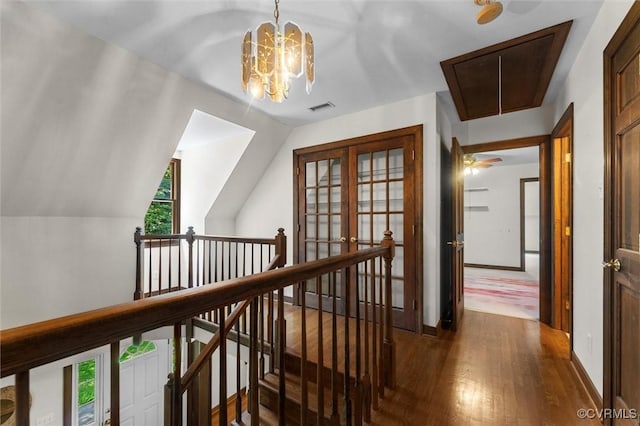 124 Gammons Vw, Bumpass, VA 23024 - hall with an upstairs landing, attic access, dark wood-style flooring, lofted ceiling, and a chandelier