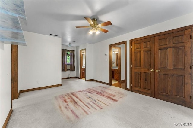 124 Gammons Vw, Bumpass, VA 23024 - unfurnished bedroom with light carpet, ensuite bathroom, and ceiling fan