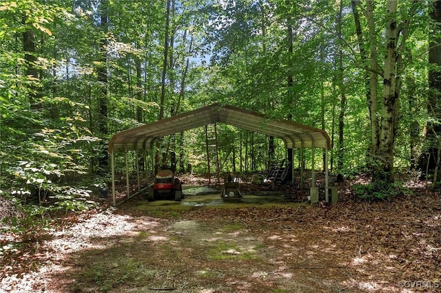 124 Gammons Vw, Bumpass, VA 23024 - view of property's community with a detached carport and a view of trees