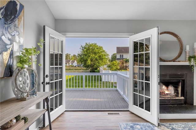 2505 Winston Ct, Glen Allen, VA 23060 - doorway to outside with french doors, wood finished floors, and a lit fireplace
