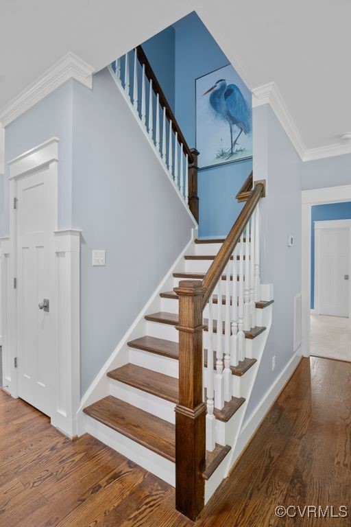 2432 Gammons Creek Dr, Maidens, VA 23102 - staircase featuring wood finished floors and ornamental molding