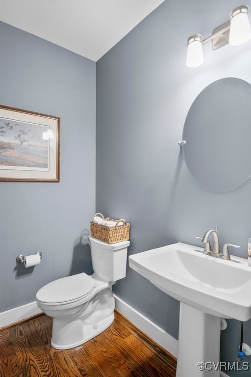 2432 Gammons Creek Dr, Maidens, VA 23102 - half bathroom featuring baseboards and wood finished floors