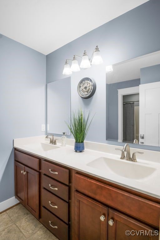 2432 Gammons Creek Dr, Maidens, VA 23102 - full bathroom with double vanity and tile patterned floors