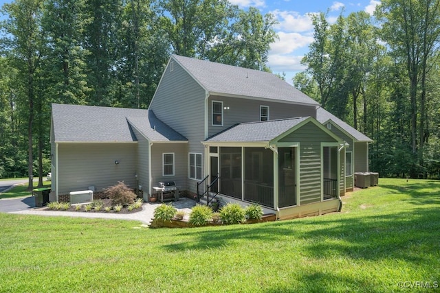 2432 Gammons Creek Dr, Maidens, VA 23102 - rear view of property with a sunroom, a lawn, a shingled roof, and a patio