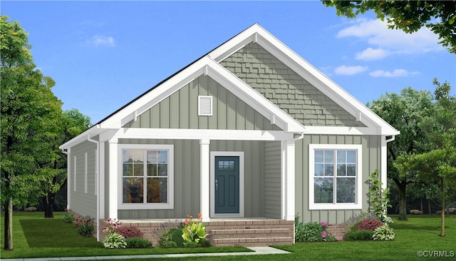 447 Raleigh Ave, South Hill, VA 23970 - view of front of house with board and batten siding, a front lawn, and a porch