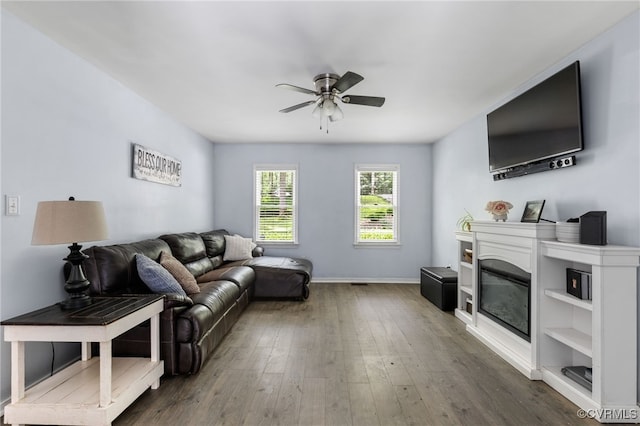 2708 Pineridge Ln, Powhatan, VA 23139 - living area with ceiling fan, wood finished floors, and a glass covered fireplace