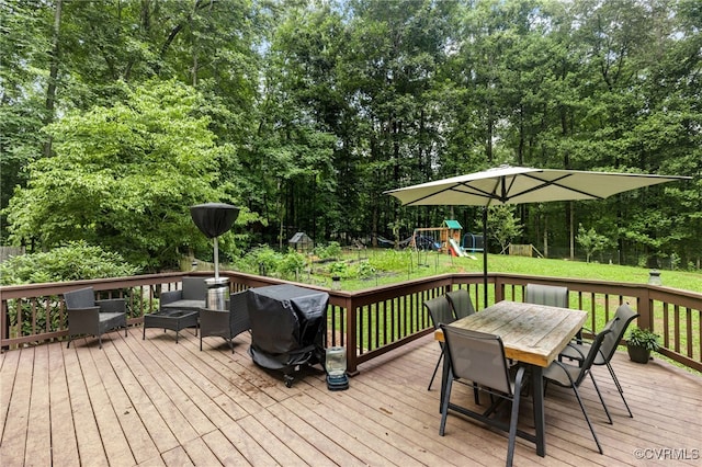 2708 Pineridge Ln, Powhatan, VA 23139 - deck with a playground, outdoor dining space, a yard, area for grilling, and view of wooded area