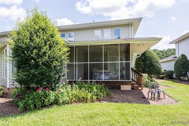 10966 Bland Ridge Dr, South Prince George, VA 23805 - rear view of property with a sunroom and a lawn