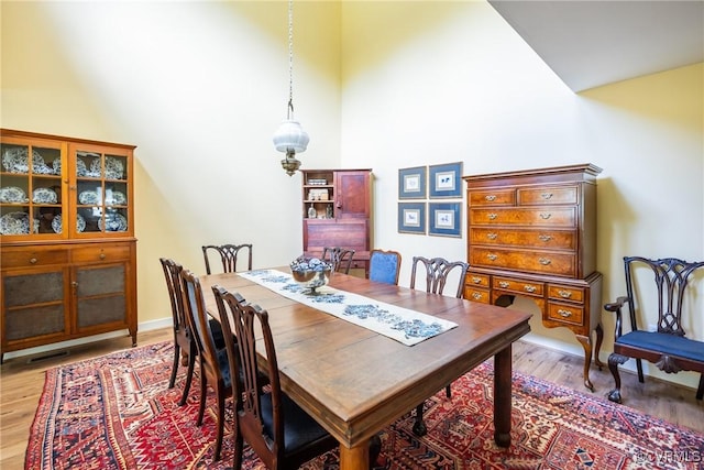 10966 Bland Ridge Dr, South Prince George, VA 23805 - dining room with light wood-style flooring and high vaulted ceiling