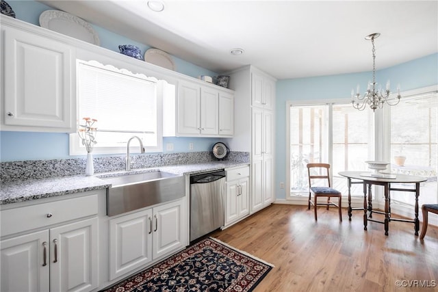 10966 Bland Ridge Dr, South Prince George, VA 23805 - kitchen featuring stainless steel dishwasher, white cabinets, light wood-style flooring, and a chandelier