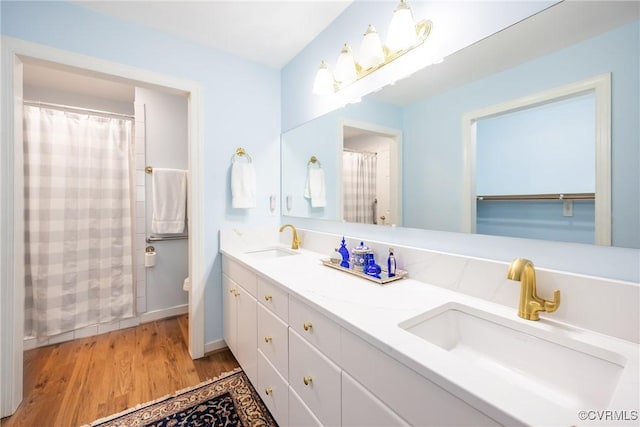 10966 Bland Ridge Dr, South Prince George, VA 23805 - bathroom featuring double vanity, wood finished floors, and a shower with curtain