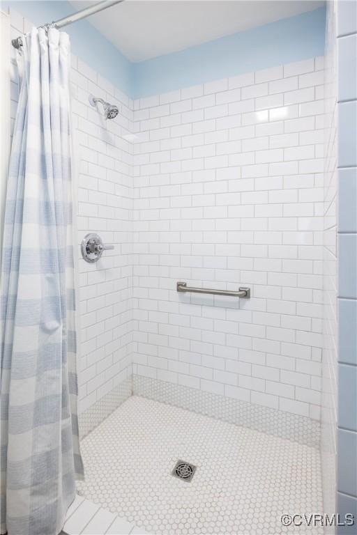 10966 Bland Ridge Dr, South Prince George, VA 23805 - bathroom with a stall shower and tile patterned floors
