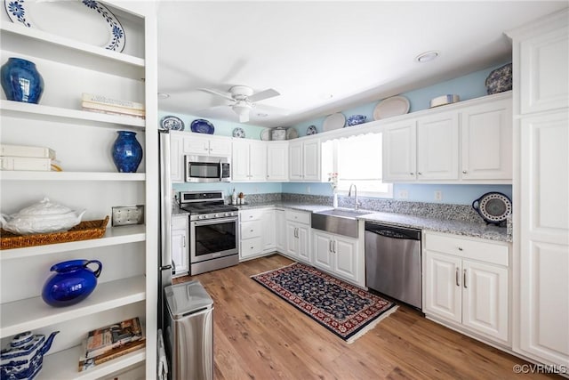 10966 Bland Ridge Dr, South Prince George, VA 23805 - kitchen with stainless steel appliances, white cabinetry, light wood-style flooring, light stone counters, and recessed lighting