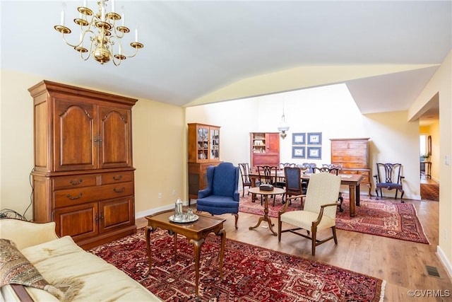 10966 Bland Ridge Dr, South Prince George, VA 23805 - living area featuring lofted ceiling, light wood-type flooring, and a chandelier