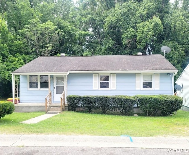 422 Walnut St, Petersburg, VA 23803 - view of front of property with a front yard and roof with shingles