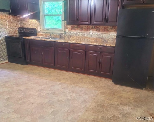 422 Walnut St, Petersburg, VA 23803 - kitchen with black appliances, ventilation hood, decorative backsplash, and light stone counters