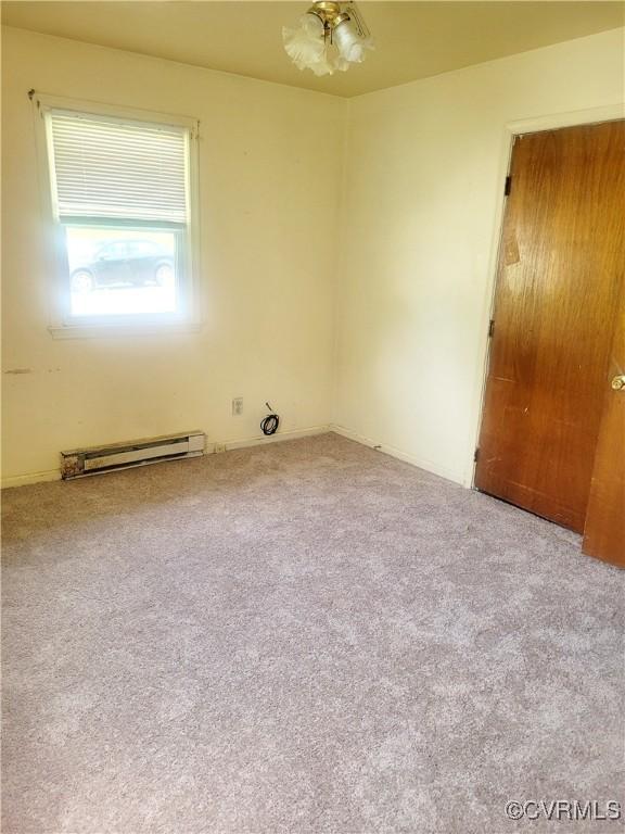422 Walnut St, Petersburg, VA 23803 - carpeted spare room featuring baseboard heating